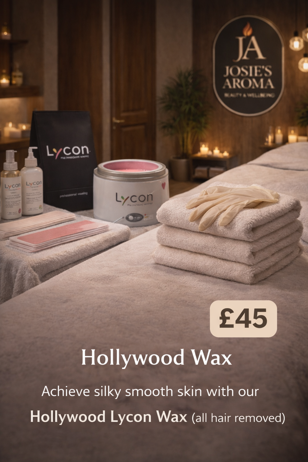 Hollywood Wax products and tools arranged on a spa table in a softly lit beauty salon setting.